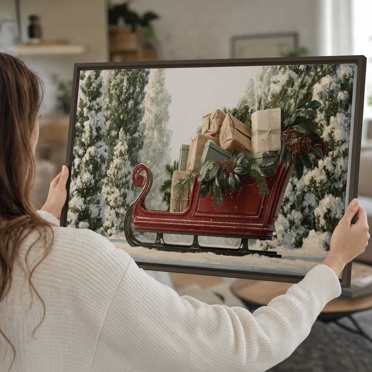A red sleigh filled with wrapped gifts and evergreen branches among snowy fir trees single framed canvas wall art held in hands