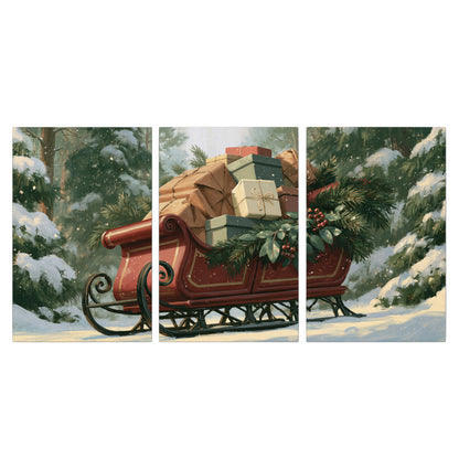 A red sleigh stacked with warm neutral gifts beneath snow-covered evergreen branches 3 piece canvas wall art viewed straight on