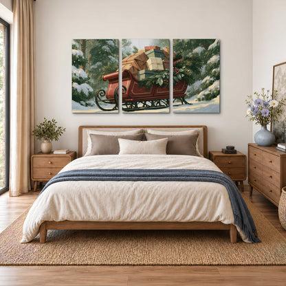 A red sleigh stacked with warm neutral gifts beneath snow-covered evergreen branches 3 piece canvas wall art styled in an interior