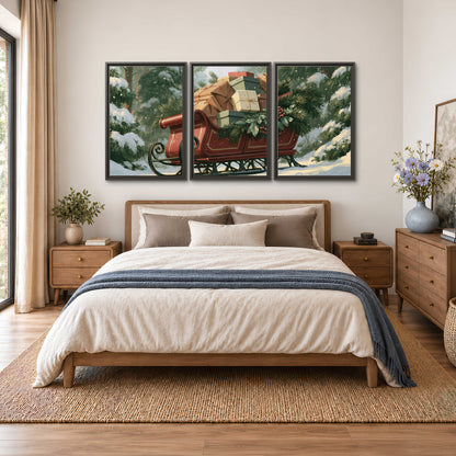 A red sleigh stacked with warm neutral gifts beneath snow-covered evergreen branches 3 piece framed canvas wall art styled in an interior