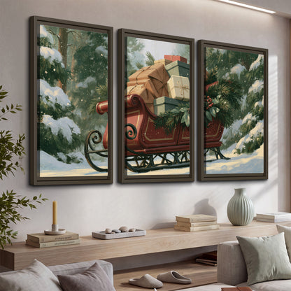A red sleigh stacked with warm neutral gifts beneath snow-covered evergreen branches 3 piece framed canvas wall art displayed in a console
