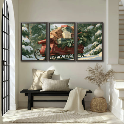 A red sleigh stacked with warm neutral gifts beneath snow-covered evergreen branches 3 piece framed canvas wall art displayed in a entryway