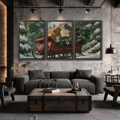 A red sleigh stacked with warm neutral gifts beneath snow-covered evergreen branches 3 piece framed canvas wall art displayed in a industrial room
