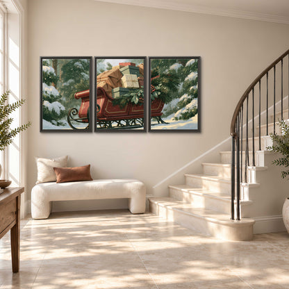 A red sleigh stacked with warm neutral gifts beneath snow-covered evergreen branches 3 piece framed canvas wall art styled in an interior