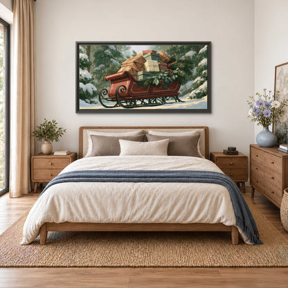 A red sleigh stacked with warm neutral gifts beneath snow-covered evergreen branches single framed canvas wall art styled in an interior