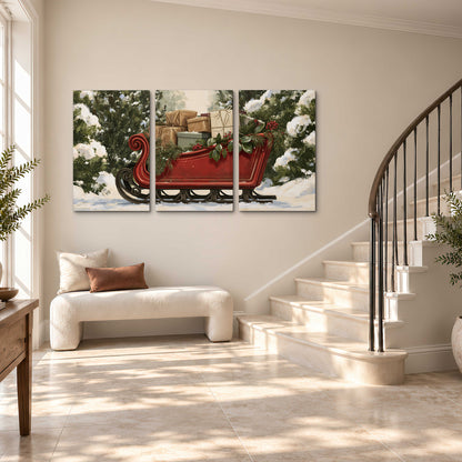 A decorative red holiday sleigh carrying wrapped presents and greenery through a snowy woodland 3 piece canvas wall art styled in an interior
