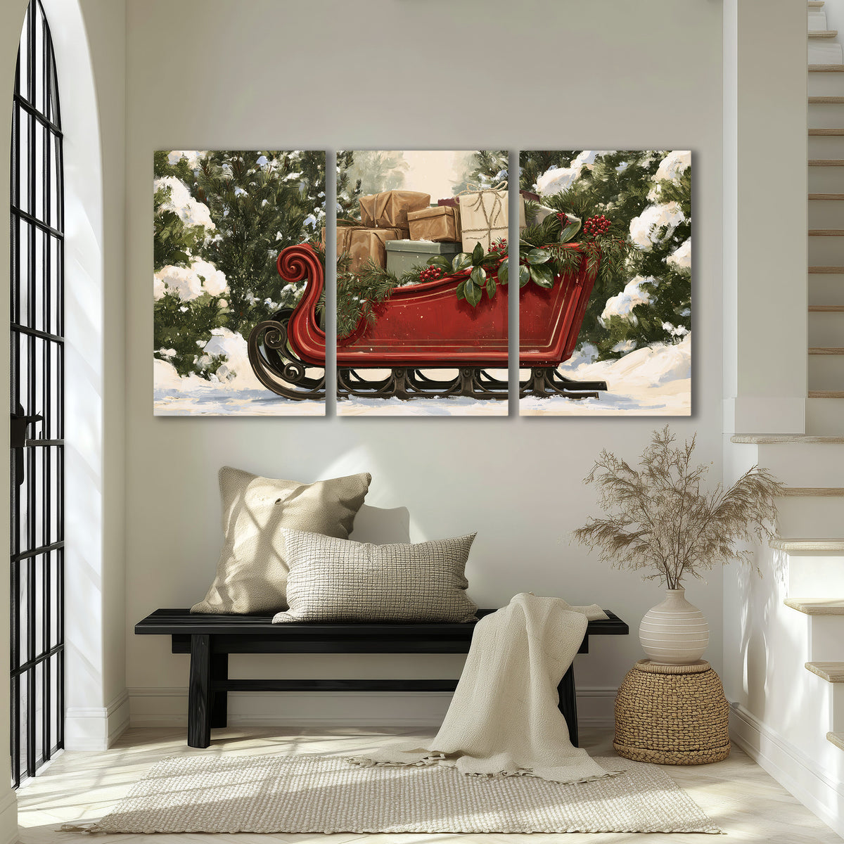 A decorative red holiday sleigh carrying wrapped presents and greenery through a snowy woodland 3 piece canvas wall art displayed in a entryway