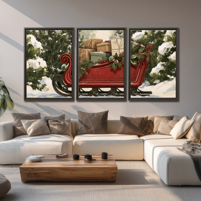 A decorative red holiday sleigh carrying wrapped presents and greenery through a snowy woodland 3 piece framed canvas wall art displayed in a living room