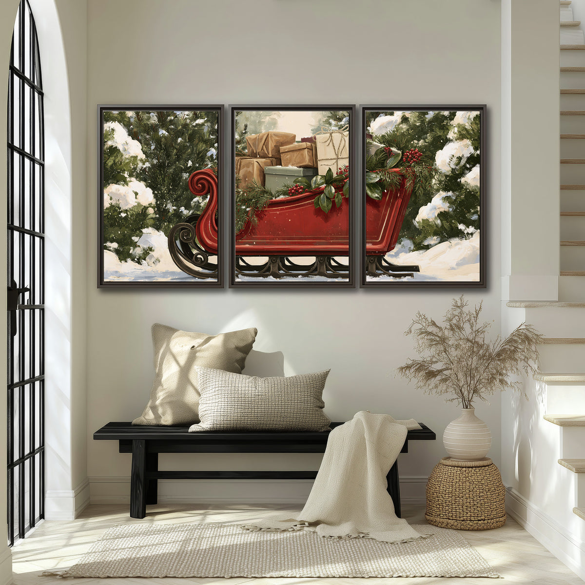A decorative red holiday sleigh carrying wrapped presents and greenery through a snowy woodland 3 piece framed canvas wall art displayed in a entryway