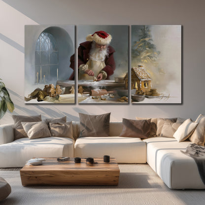 Santa working with dough beside a gingerbread house in a softly lit Christmas kitchen 3 piece canvas wall art displayed in a living room