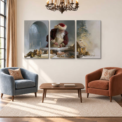 Santa working with dough beside a gingerbread house in a softly lit Christmas kitchen 3 piece canvas wall art styled in an interior