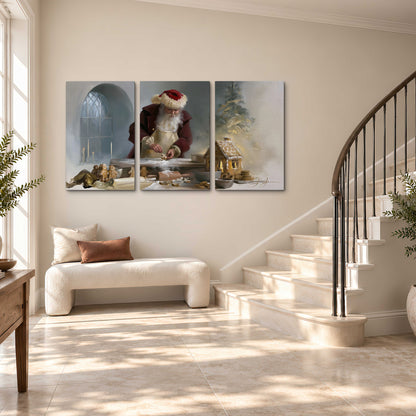 Santa working with dough beside a gingerbread house in a softly lit Christmas kitchen 3 piece canvas wall art styled in an interior