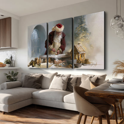 Santa working with dough beside a gingerbread house in a softly lit Christmas kitchen 3 piece canvas wall art room and product view