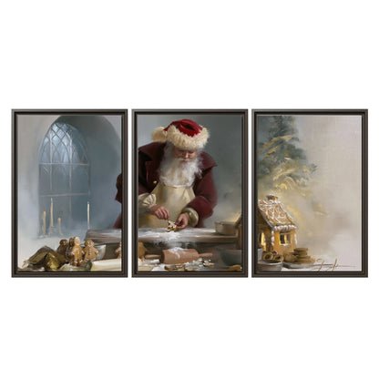 Santa working with dough beside a gingerbread house in a softly lit Christmas kitchen 3 piece framed canvas wall art viewed straight on