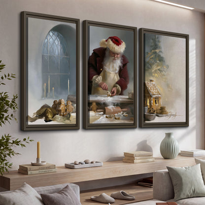 Santa working with dough beside a gingerbread house in a softly lit Christmas kitchen 3 piece framed canvas wall art displayed in a console
