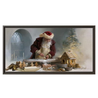 Santa working with dough beside a gingerbread house in a softly lit Christmas kitchen single framed canvas wall art viewed straight on