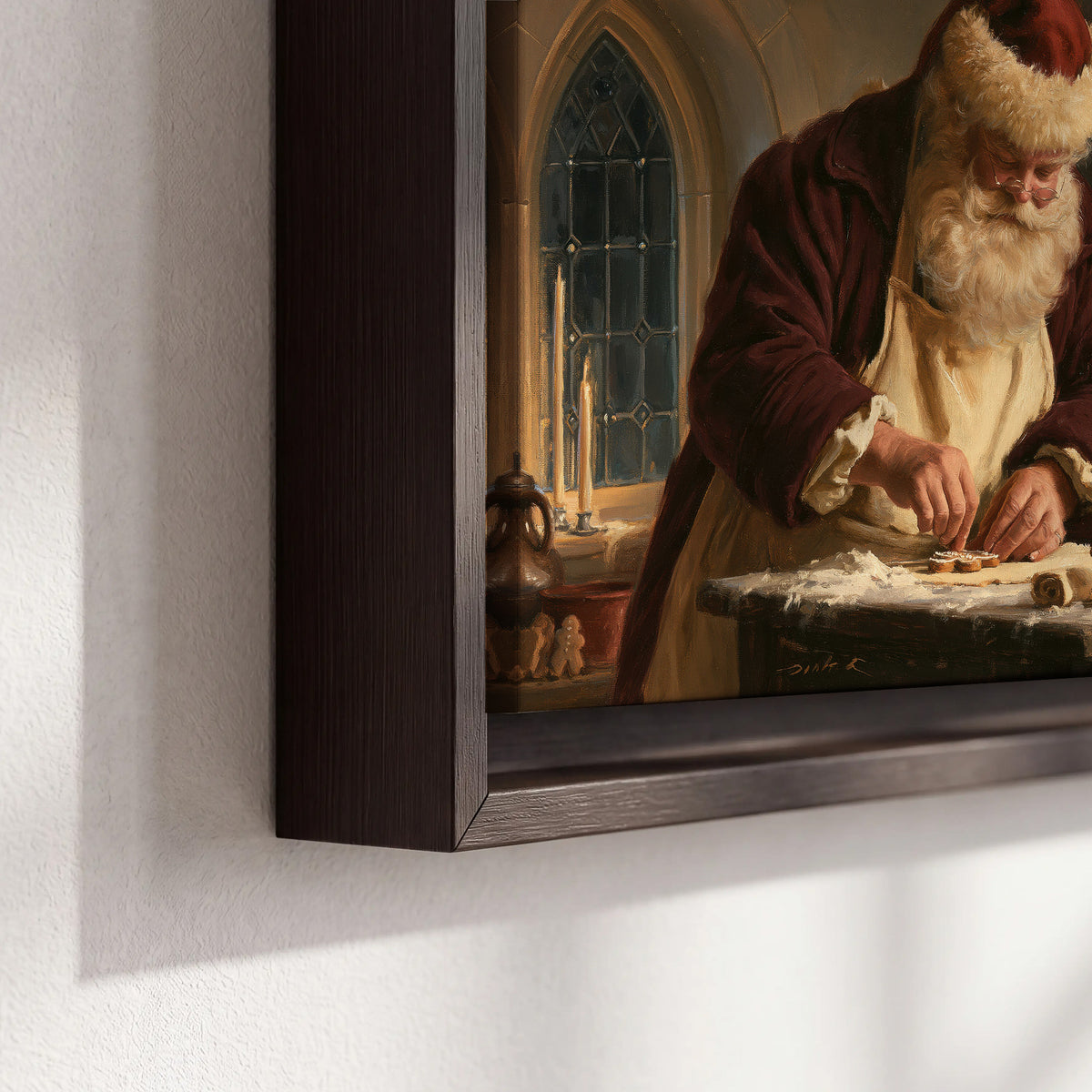 Santa shaping a gingerbread creation at a worktable beside a glowing Christmas tree 3 piece framed canvas wall art material and edge close up
