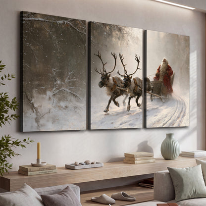 Santa riding a reindeer-drawn sleigh along a winding snowy woodland path 3 piece canvas wall art displayed in a console