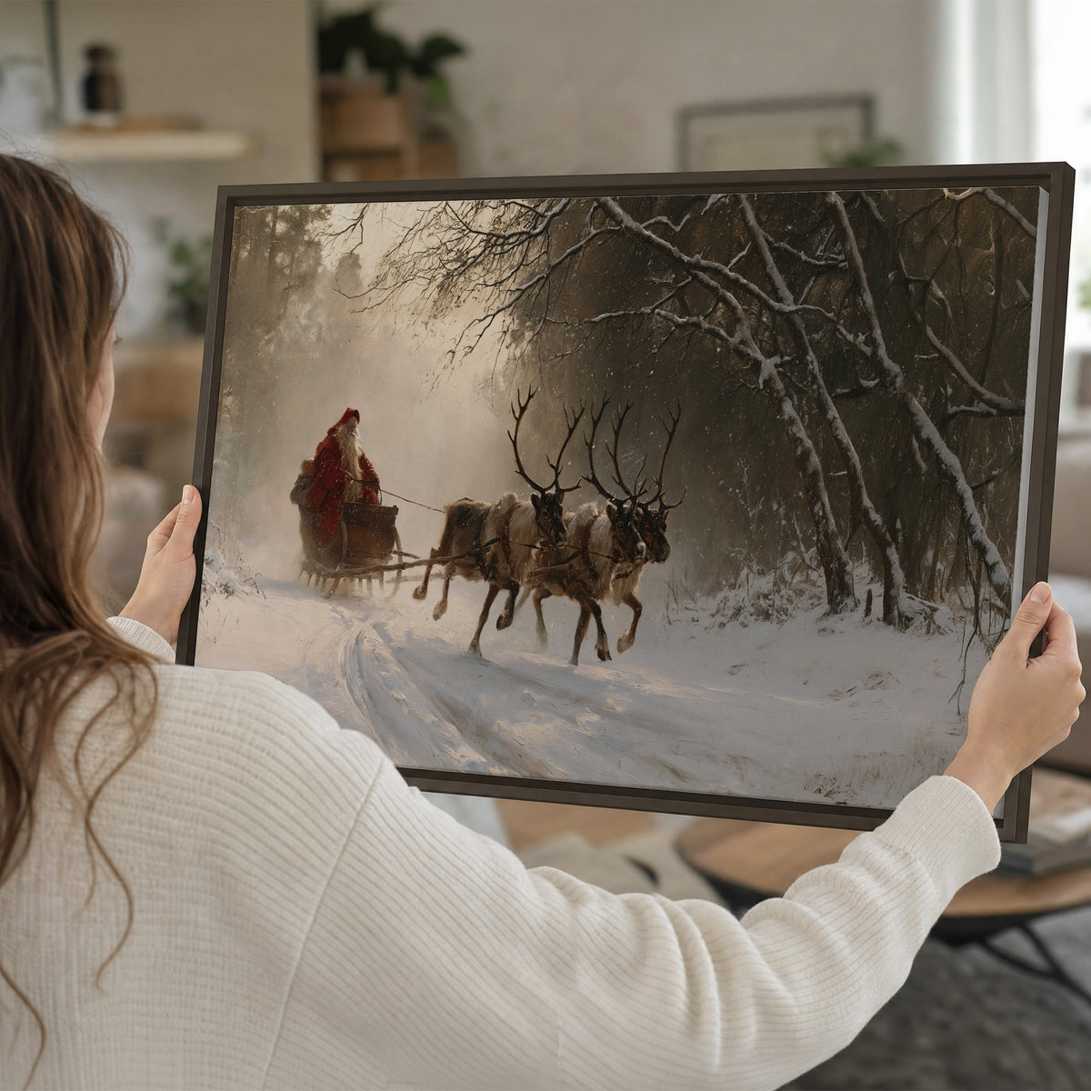 A reindeer team pulling Santa through a quiet snow-covered forest single framed canvas wall art held in hands
