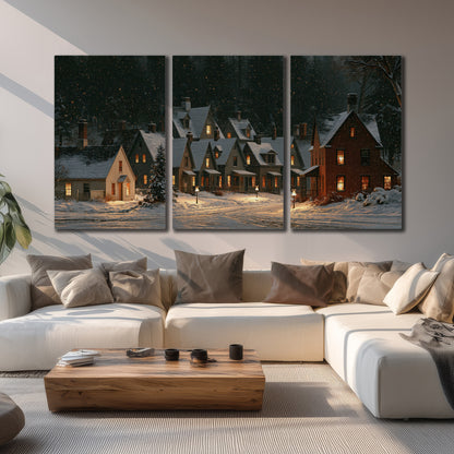 Snow-covered village cottages with glowing windows beneath a dark evergreen forest 3 piece canvas wall art displayed in a living room