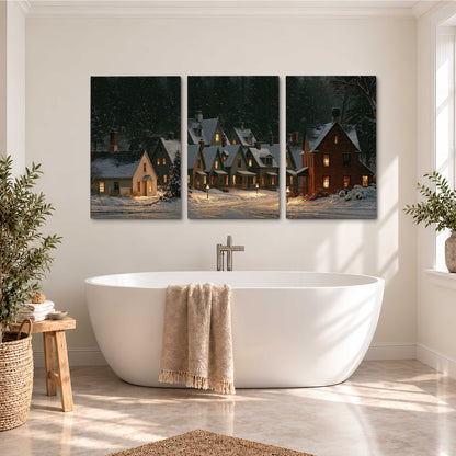 Snow-covered village cottages with glowing windows beneath a dark evergreen forest 3 piece canvas wall art styled in an interior