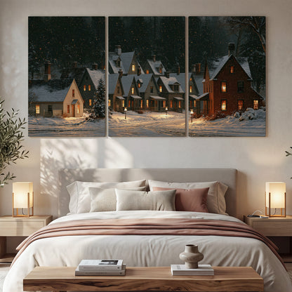 Snow-covered village cottages with glowing windows beneath a dark evergreen forest 3 piece canvas wall art displayed in a bedroom