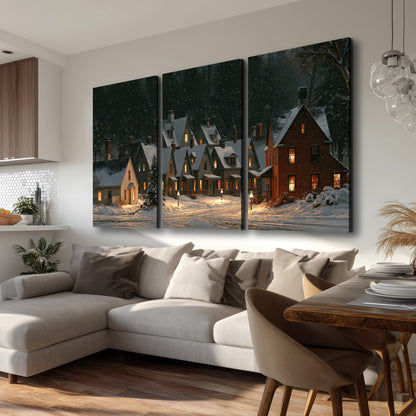 Snow-covered village cottages with glowing windows beneath a dark evergreen forest 3 piece canvas wall art room and product view