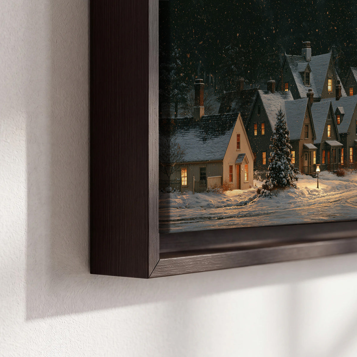 Snow-covered village cottages with glowing windows beneath a dark evergreen forest 3 piece framed canvas wall art material and edge close up