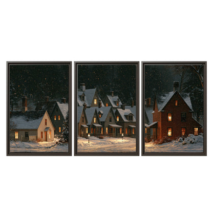 Snow-covered village cottages with glowing windows beneath a dark evergreen forest 3 piece framed canvas wall art viewed straight on