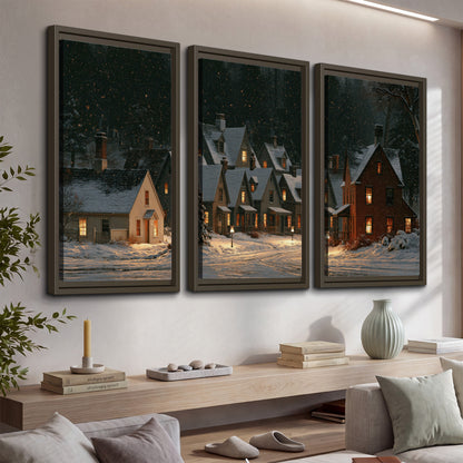 Snow-covered village cottages with glowing windows beneath a dark evergreen forest 3 piece framed canvas wall art displayed in a console