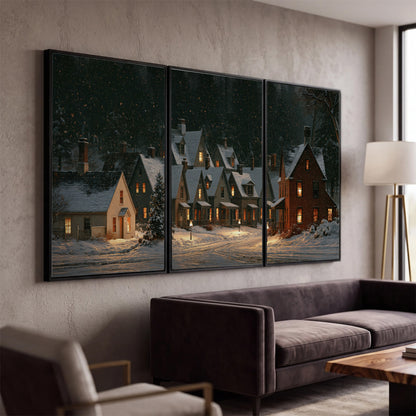 Snow-covered village cottages with glowing windows beneath a dark evergreen forest 3 piece framed canvas wall art displayed in a modern living room