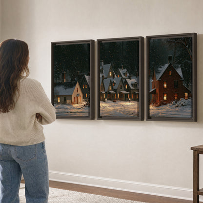 Snow-covered village cottages with glowing windows beneath a dark evergreen forest 3 piece framed canvas wall art three panel arrangement on a wall