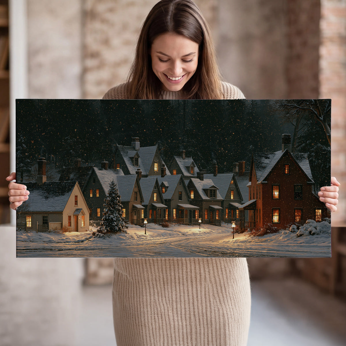 Snow-covered village cottages with glowing windows beneath a dark evergreen forest single canvas wall art held in hands