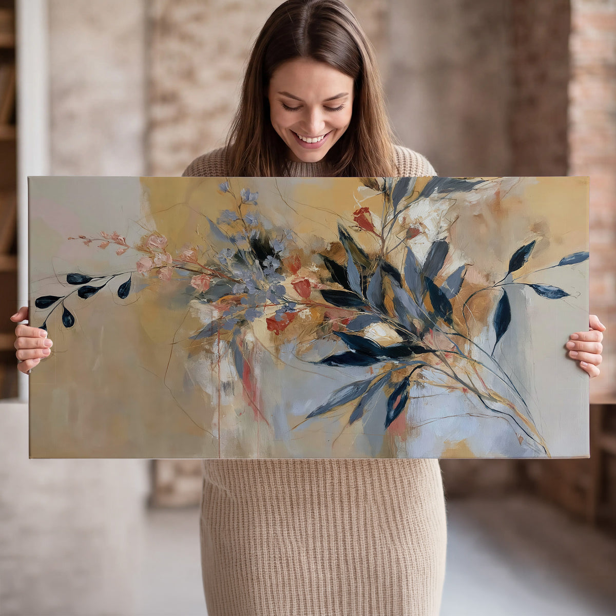 Loose dark blue leaves and pale blossoms on a warm beige painterly background single canvas wall art held in hands