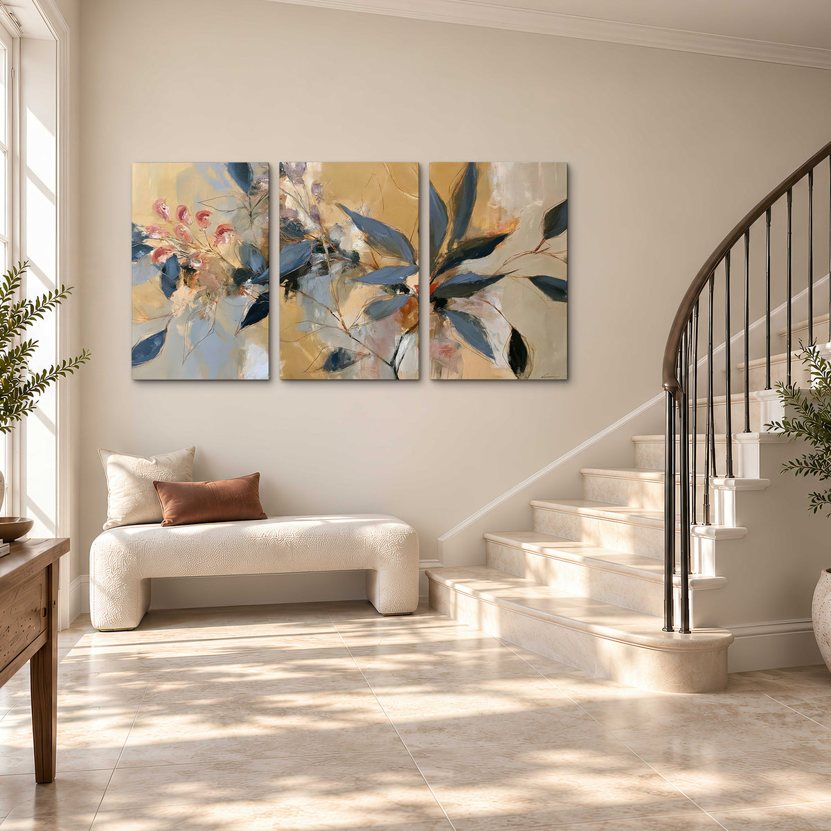 Layered navy leaves and muted pink blossoms against a golden cream background 3 piece canvas wall art styled in an interior