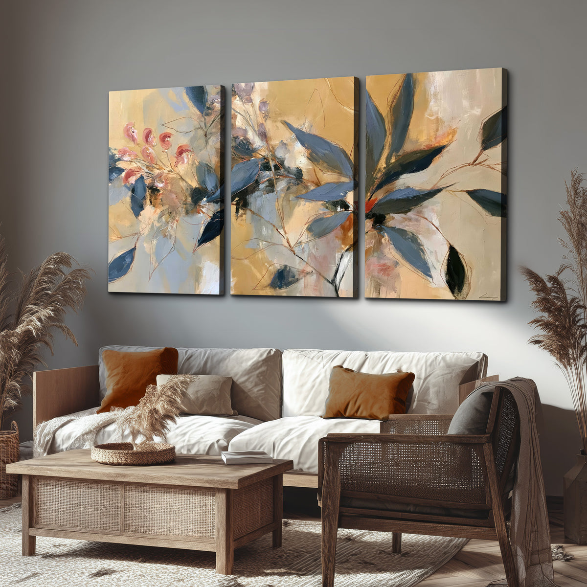 Layered navy leaves and muted pink blossoms against a golden cream background 3 piece canvas wall art displayed in a rustic living room