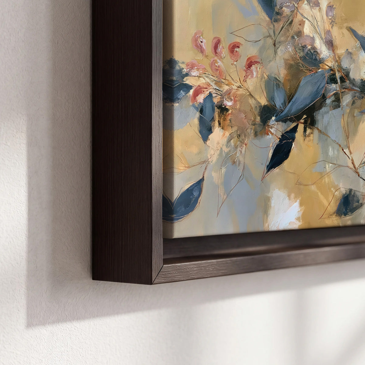 Layered navy leaves and muted pink blossoms against a golden cream background 3 piece framed canvas wall art material and edge close up