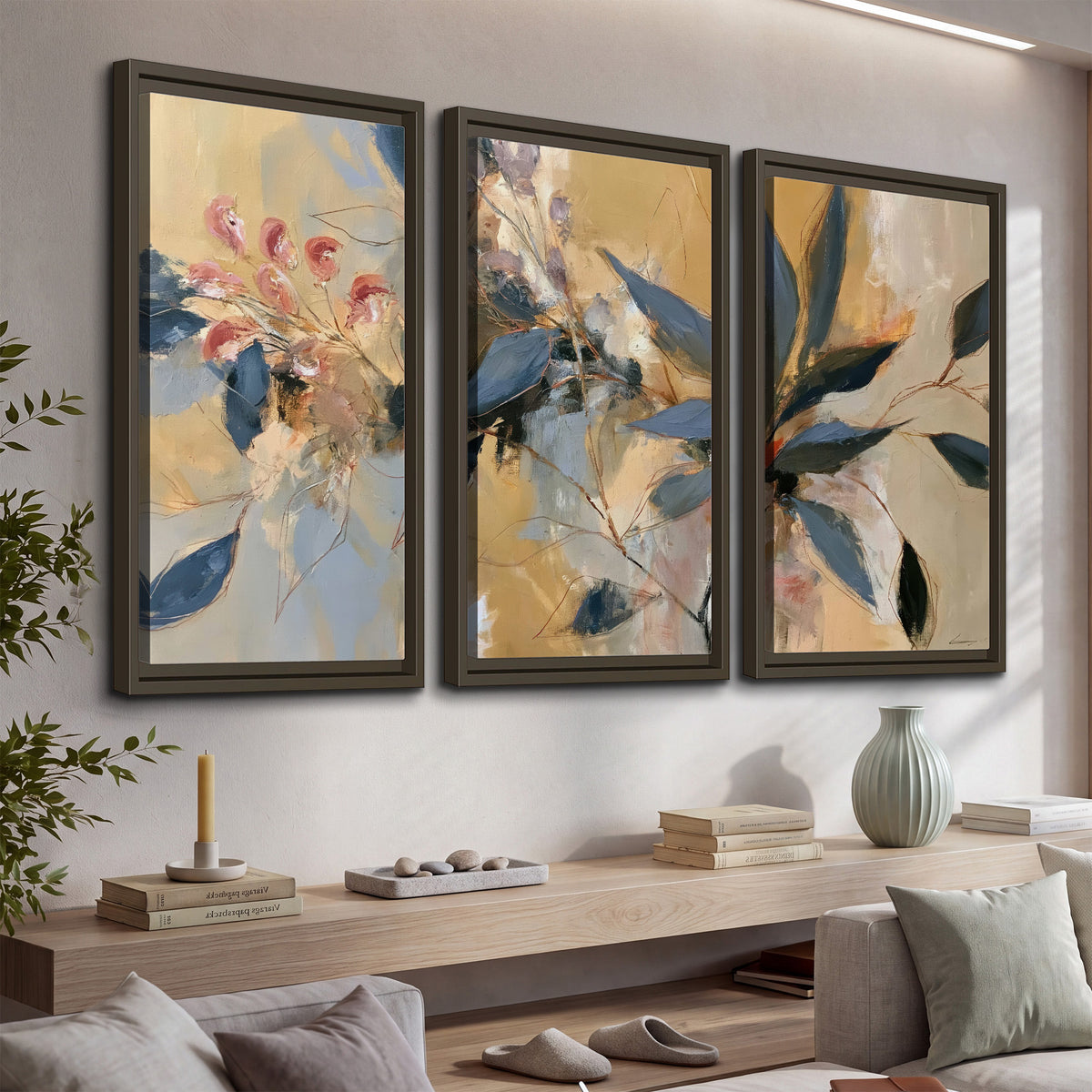 Layered navy leaves and muted pink blossoms against a golden cream background 3 piece framed canvas wall art displayed in a console