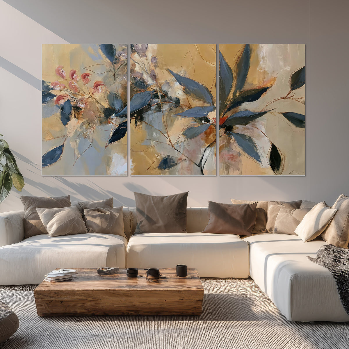 Layered navy leaves and muted pink blossoms against a golden cream background set of 3 poster prints displayed in a living room