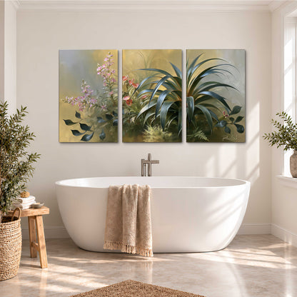 Arching green leaves beside delicate pink garden flowers in soft warm light 3 piece canvas wall art styled in an interior