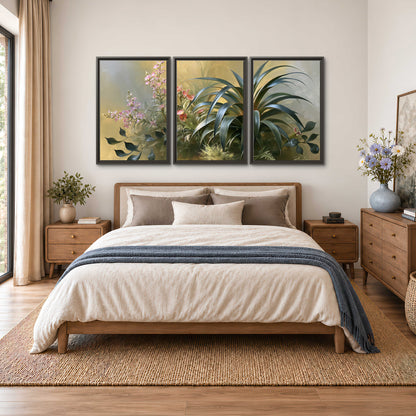 Arching green leaves beside delicate pink garden flowers in soft warm light 3 piece framed canvas wall art styled in an interior