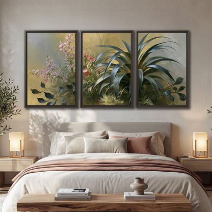 Arching green leaves beside delicate pink garden flowers in soft warm light 3 piece framed canvas wall art displayed in a bedroom
