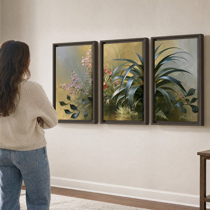 Arching green leaves beside delicate pink garden flowers in soft warm light 3 piece framed canvas wall art three panel arrangement on a wall