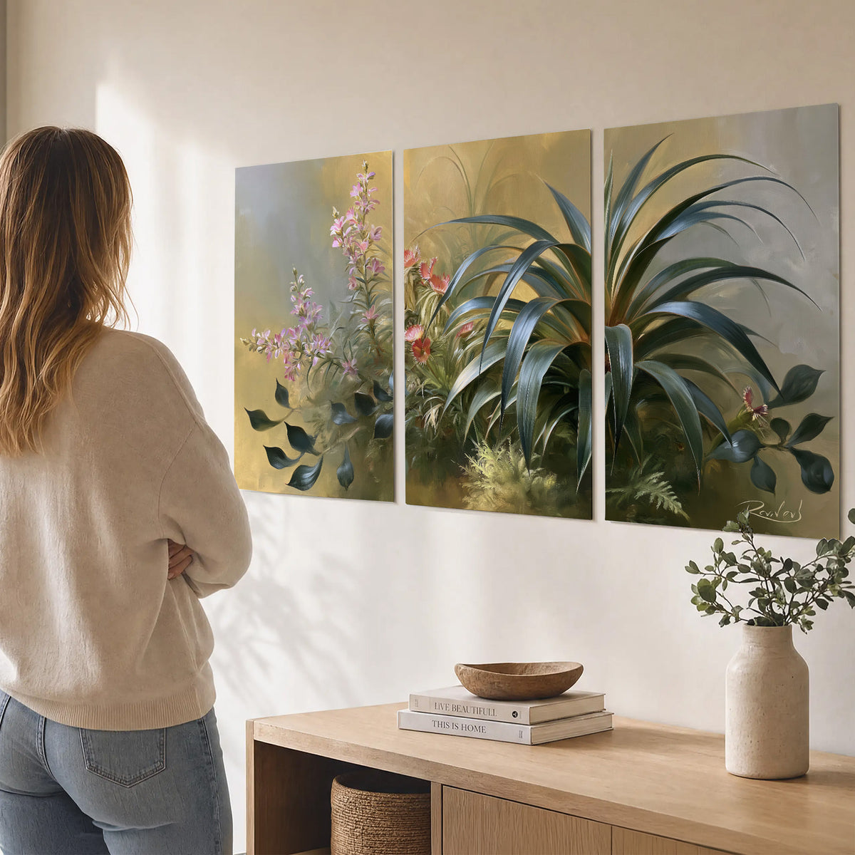 Arching green leaves beside delicate pink garden flowers in soft warm light set of 3 poster prints three panel arrangement on a wall