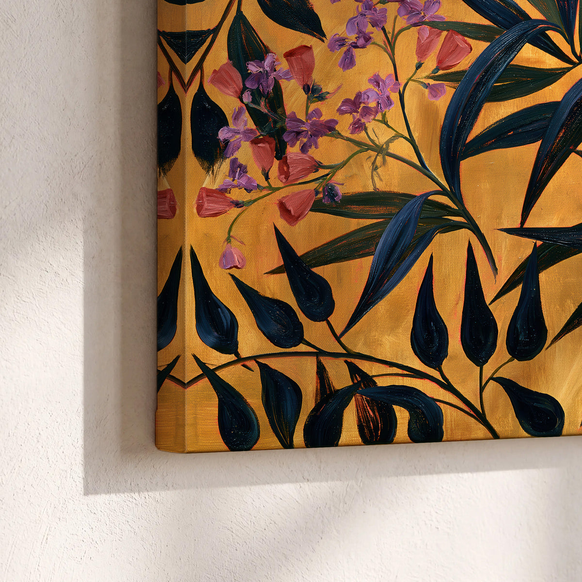 Dark pointed bamboo leaves across an ochre background with small pink floral accents 3 piece canvas wall art material and edge close up