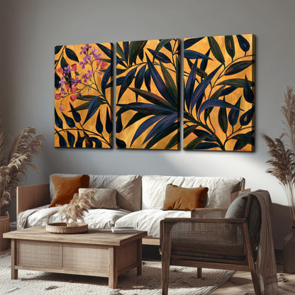 Dark pointed bamboo leaves across an ochre background with small pink floral accents 3 piece canvas wall art displayed in a rustic living room