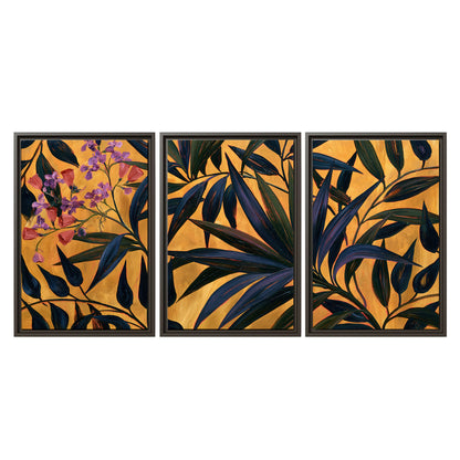 Dark pointed bamboo leaves across an ochre background with small pink floral accents 3 piece framed canvas wall art viewed straight on