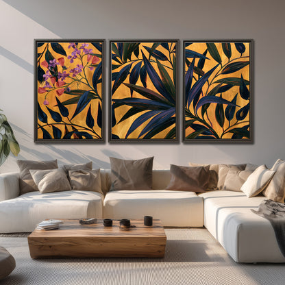 Dark pointed bamboo leaves across an ochre background with small pink floral accents 3 piece framed canvas wall art displayed in a living room