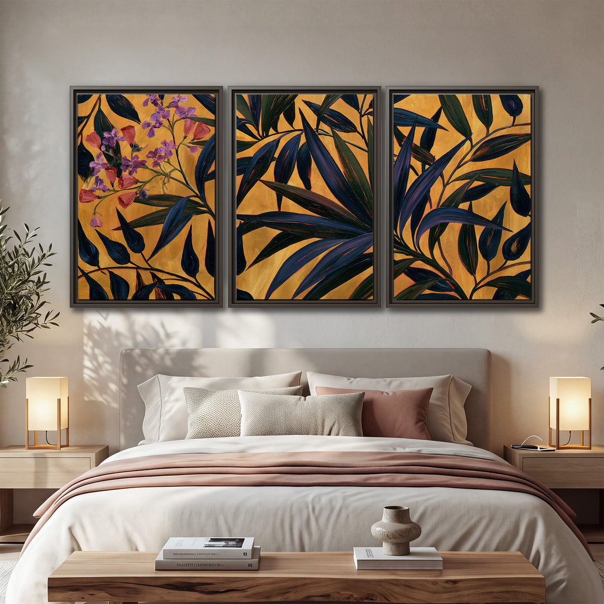 Dark pointed bamboo leaves across an ochre background with small pink floral accents 3 piece framed canvas wall art displayed in a bedroom