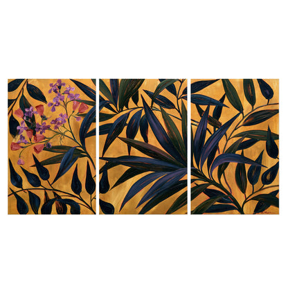 Dark pointed bamboo leaves across an ochre background with small pink floral accents set of 3 poster prints viewed straight on